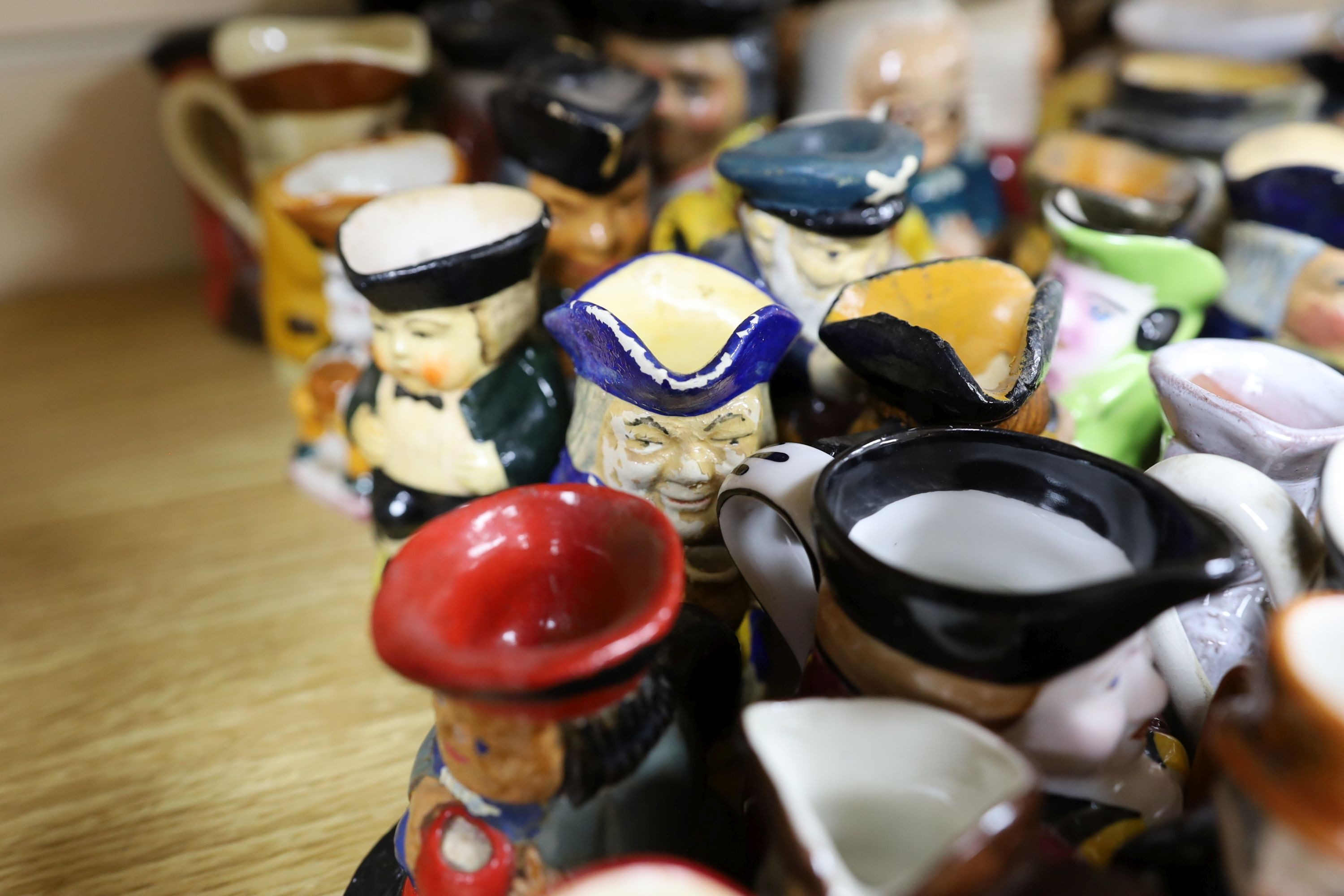 Fifty two miniature Toby jugs